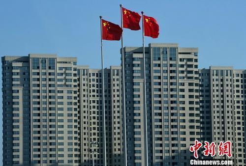����ͼ��һ���ս����깤�ķ��ز�¥�̡� <a target='_blank' href='http://www.chinanews.com/'>������</a>���� �ű� ��